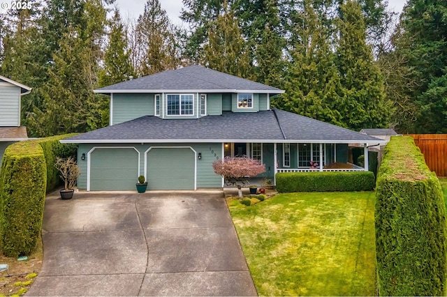 view of front of house with covered porch, fence, concrete driveway, roof with shingles, and a front lawn