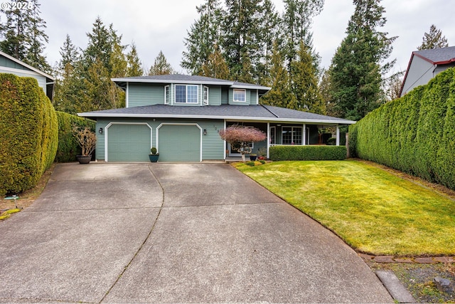 view of front of home with a front yard, driveway, and fence