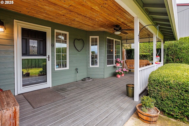 deck with a porch and a ceiling fan