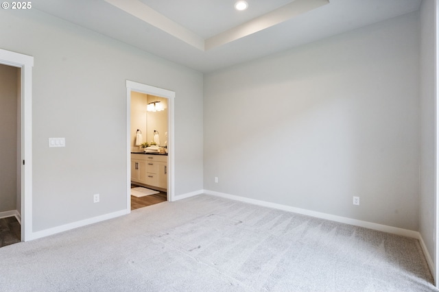 6429 SE Provence St, Hillsboro, OR 97123 - unfurnished bedroom featuring carpet, baseboards, ensuite bath, recessed lighting, and a raised ceiling