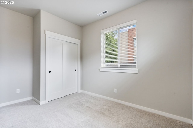 6429 SE Provence St, Hillsboro, OR 97123 - unfurnished bedroom featuring light carpet, baseboards, and a closet