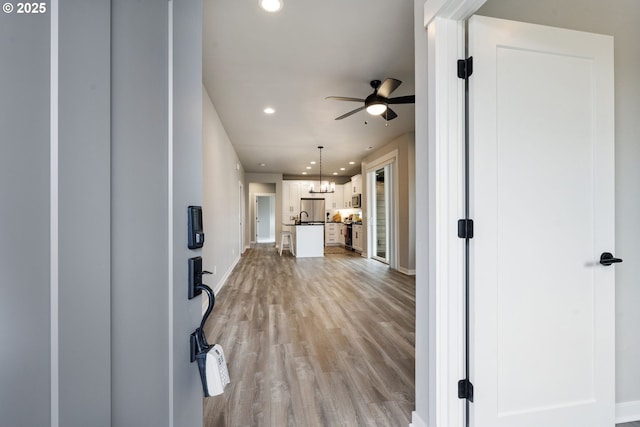 6429 SE Provence St, Hillsboro, OR 97123 - entryway featuring ceiling fan, recessed lighting, light wood finished floors, and baseboards