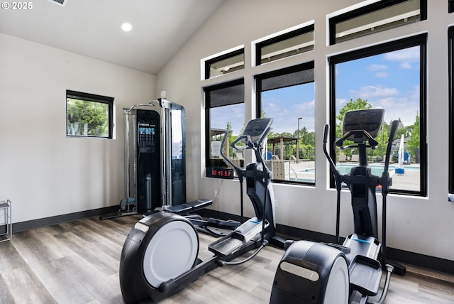 6429 SE Provence St, Hillsboro, OR 97123 - workout area with wood finished floors, baseboards, recessed lighting, and high vaulted ceiling