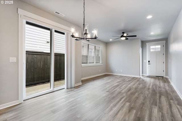 6429 SE Provence St, Hillsboro, OR 97123 - unfurnished dining area featuring a chandelier, wood finished floors, a ceiling fan, plenty of natural light, and recessed lighting