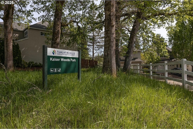 community sign featuring fence