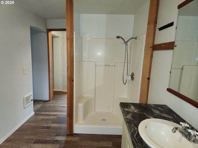 82284 Hillview Dr, Creswell, OR 97426 - bathroom featuring wood finished floors, vanity, a stall shower, and visible vents