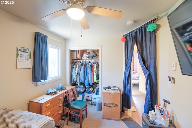 bedroom featuring ceiling fan and a closet