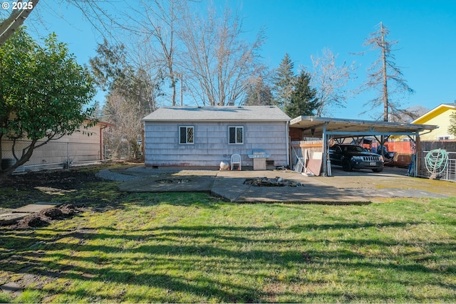 rear view of house featuring a lawn