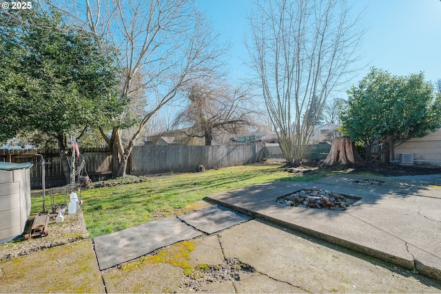 view of yard featuring a patio and an outdoor fire pit