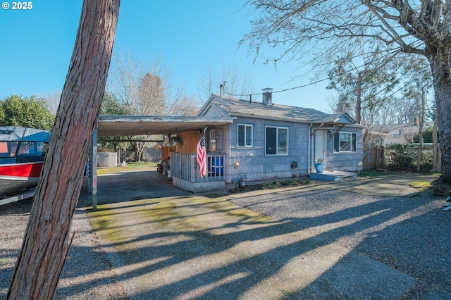 view of front of home with a carport