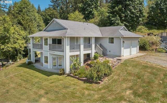 40920 NW Maple Ridge Rd, Woodland, WA 98674 - back of property featuring a yard, french doors, a garage, and roof with shingles