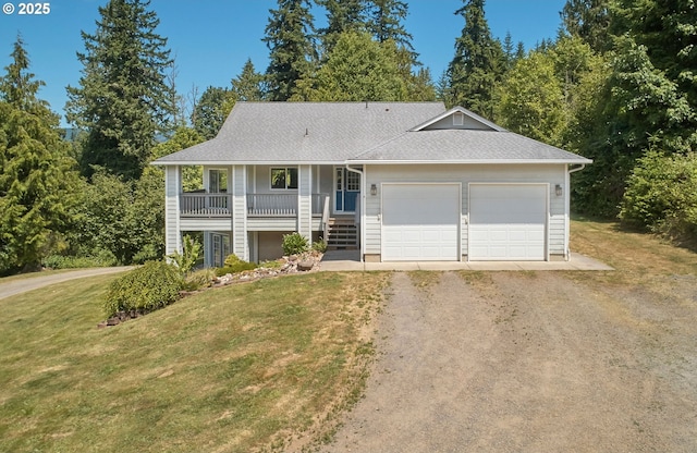 40920 NW Maple Ridge Rd, Woodland, WA 98674 - view of front facade with driveway, a front yard, an attached garage, and covered porch