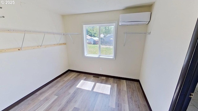 132 NE Rifle Range St, Roseburg, OR 97470 - spacious closet featuring a wall unit AC and wood finished floors