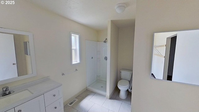132 NE Rifle Range St, Roseburg, OR 97470 - bathroom with toilet, a shower, vanity, and tile patterned floors