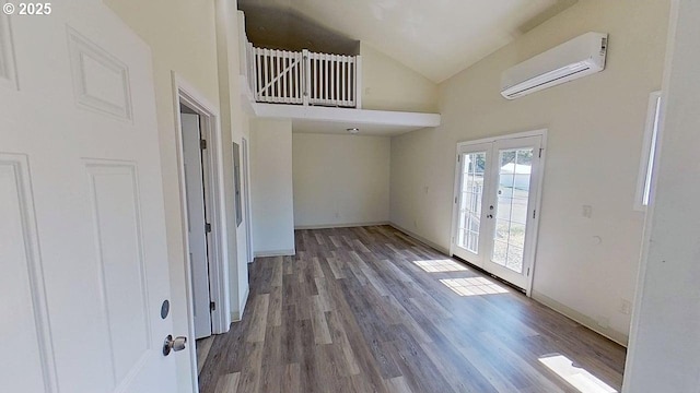 132 NE Rifle Range St, Roseburg, OR 97470 - entryway with a wall unit AC, french doors, high vaulted ceiling, wood finished floors, and baseboards