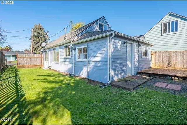 rear view of property featuring a deck