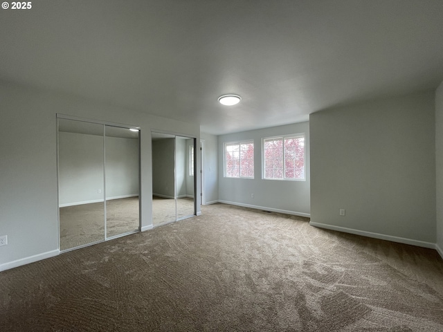 5145 Trevon St, Eugene, OR 97402 - unfurnished bedroom with carpet floors and two closets