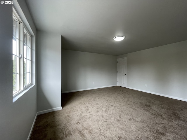 5145 Trevon St, Eugene, OR 97402 - unfurnished room with baseboards and dark colored carpet