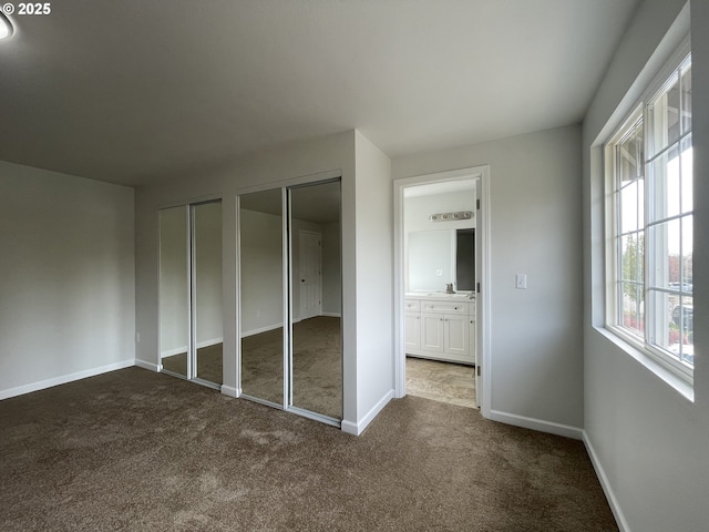 5145 Trevon St, Eugene, OR 97402 - unfurnished bedroom with two closets and dark carpet