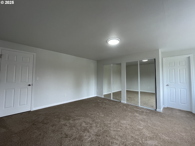 5145 Trevon St, Eugene, OR 97402 - unfurnished bedroom with two closets and dark colored carpet