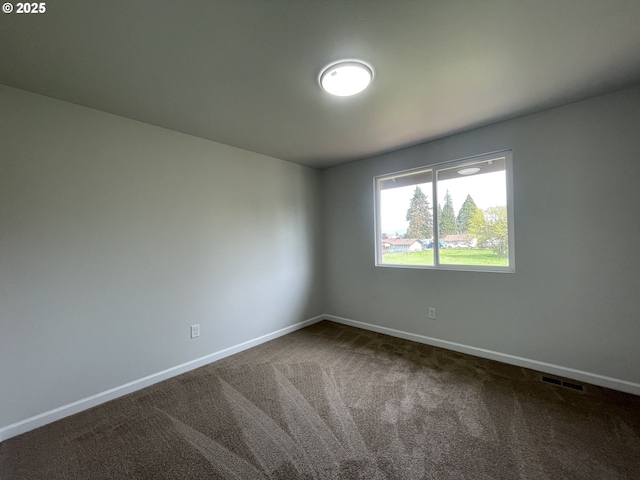 5145 Trevon St, Eugene, OR 97402 - spare room with baseboards and dark carpet