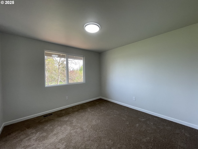 5145 Trevon St, Eugene, OR 97402 - spare room featuring dark carpet and baseboards