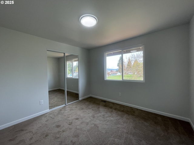 5145 Trevon St, Eugene, OR 97402 - unfurnished bedroom featuring carpet floors and a closet