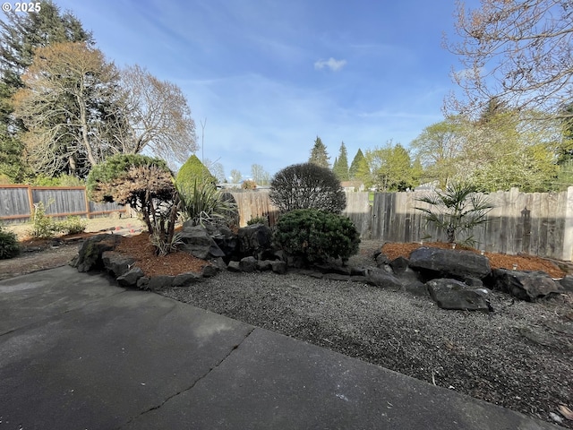 5145 Trevon St, Eugene, OR 97402 - fenced backyard with a patio