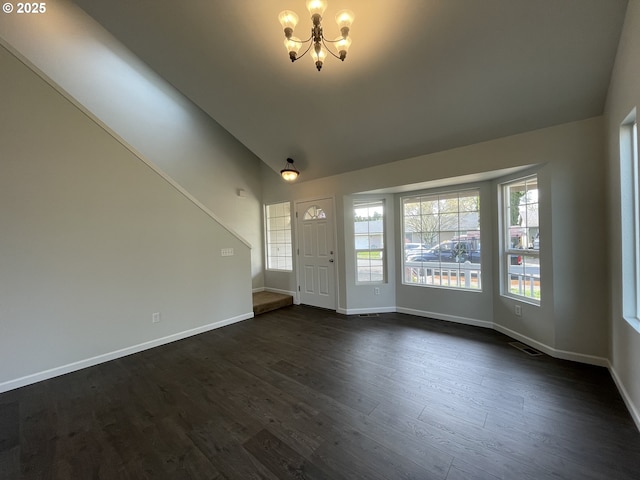 5145 Trevon St, Eugene, OR 97402 - unfurnished living room featuring a chandelier, dark wood-style floors, and vaulted ceiling