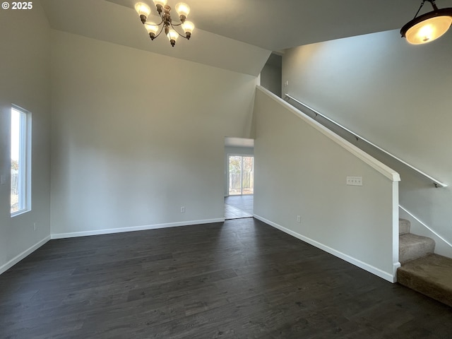 5145 Trevon St, Eugene, OR 97402 - unfurnished living room featuring a chandelier, high vaulted ceiling, stairs, and dark wood-style floors