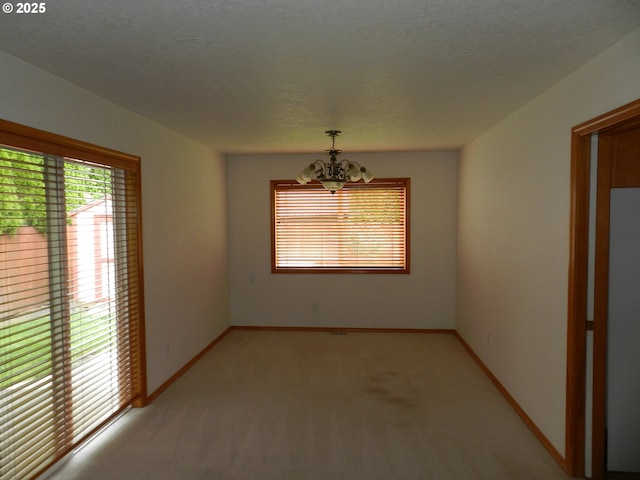 31811 NW Belgium Ct, North Plains, OR 97133 - empty room with a chandelier and light colored carpet