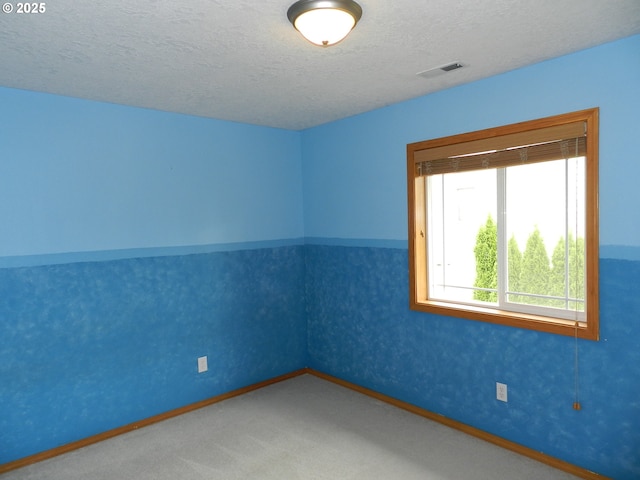 31811 NW Belgium Ct, North Plains, OR 97133 - carpeted empty room with a textured ceiling and baseboards