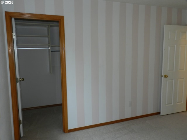 31811 NW Belgium Ct, North Plains, OR 97133 - unfurnished bedroom featuring carpet flooring, a closet, wallpapered walls, and a walk in closet