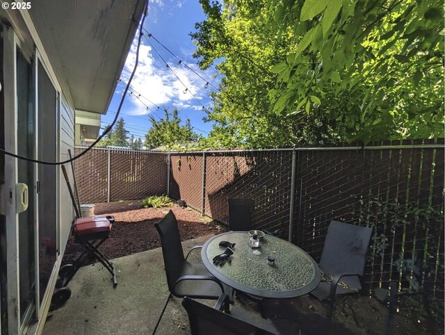 1912 SE 122nd Ave Unit 11, Portland, OR 97233 - fenced backyard featuring a patio