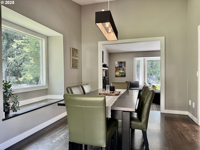 24035 SW Mountain Creek Rd, Sherwood, OR 97140 - dining area with dark wood-type flooring and baseboards