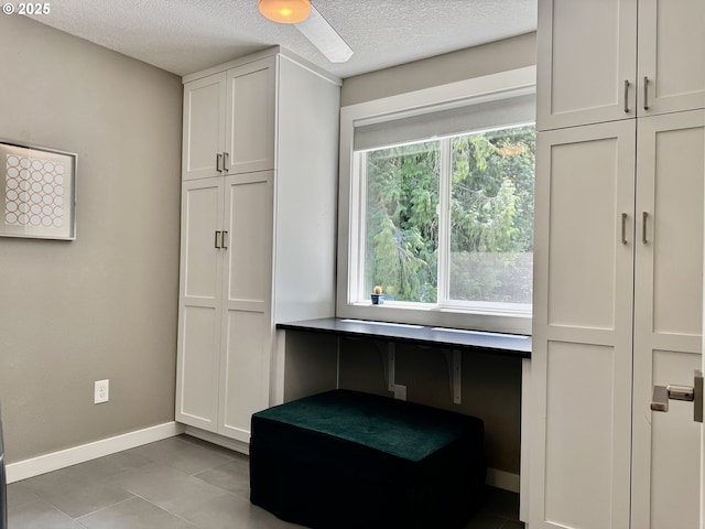 24035 SW Mountain Creek Rd, Sherwood, OR 97140 - interior space with baseboards, a textured ceiling, and light tile patterned flooring