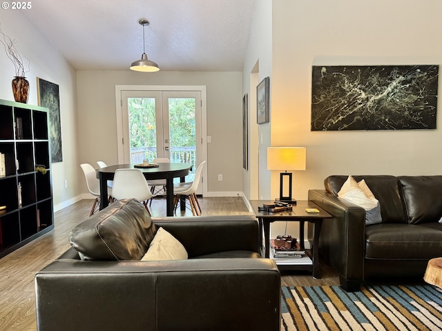 24035 SW Mountain Creek Rd, Sherwood, OR 97140 - living area with wood finished floors, baseboards, and french doors