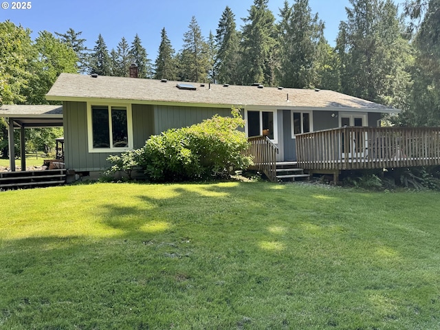 24035 SW Mountain Creek Rd, Sherwood, OR 97140 - rear view of house featuring a deck, a yard, a chimney, and board and batten siding