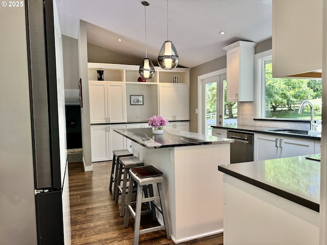 24035 SW Mountain Creek Rd, Sherwood, OR 97140 - kitchen featuring dishwasher, a center island, a sink, dark wood-style flooring, and white cabinets