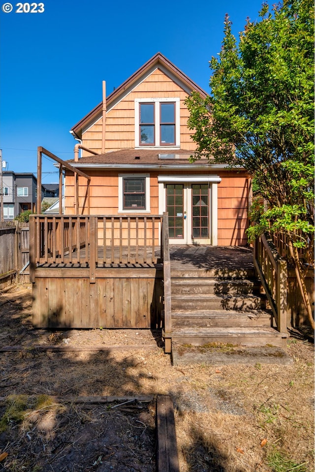 3807 NE Grand Ave, Portland, OR 97212 - rear view of property with fence, a wooden deck, and french doors