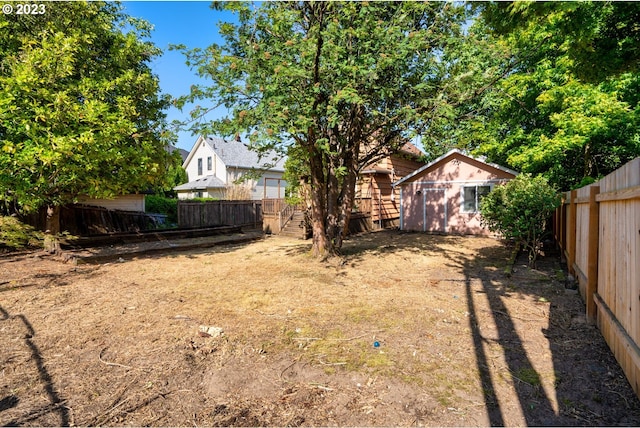 3807 NE Grand Ave, Portland, OR 97212 - view of yard featuring a fenced backyard and an outbuilding