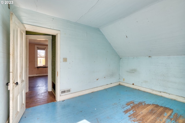 3807 NE Grand Ave, Portland, OR 97212 - bonus room featuring wood-type flooring, vaulted ceiling, visible vents, and baseboards