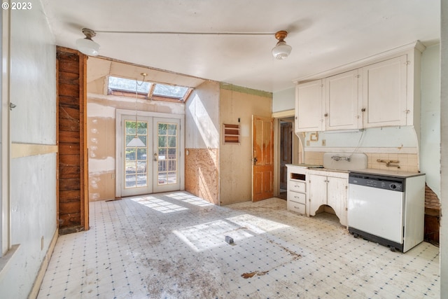 3807 NE Grand Ave, Portland, OR 97212 - kitchen with light countertops, dishwasher, french doors, a skylight, and white cabinetry
