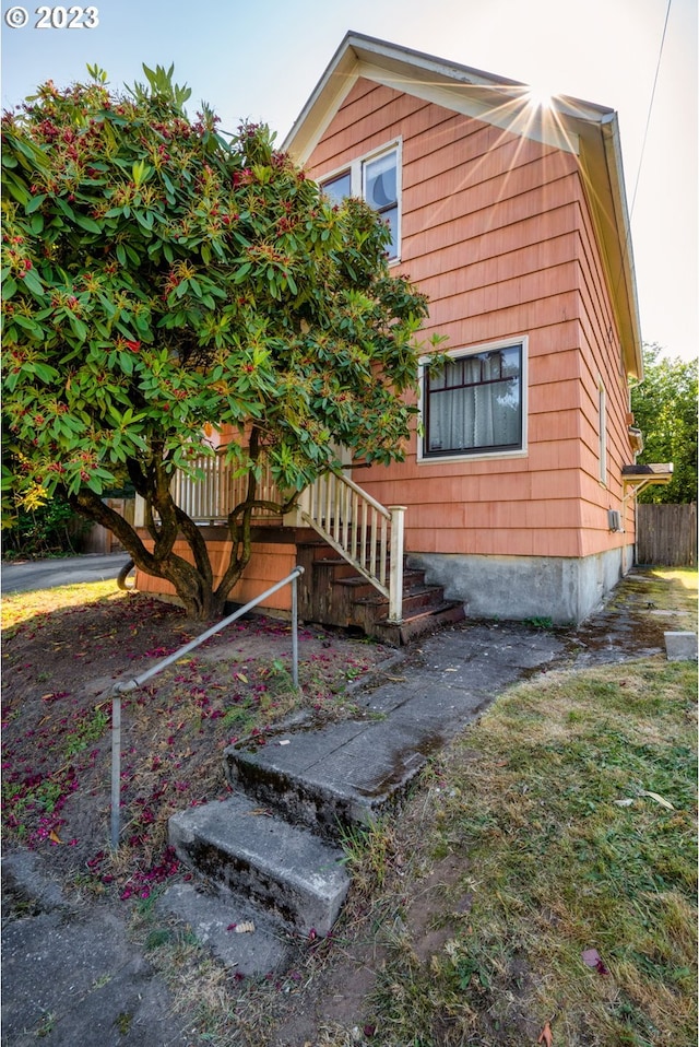 3807 NE Grand Ave, Portland, OR 97212 - view of side of home featuring stairway and fence