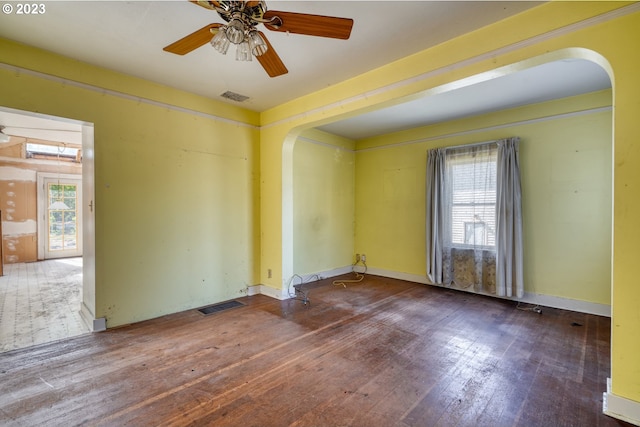 3807 NE Grand Ave, Portland, OR 97212 - empty room with wood-type flooring, arched walkways, a healthy amount of sunlight, and visible vents