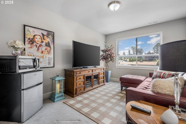 52152 Casswell Dr, Scappoose, OR 97056 - living room featuring light colored carpet and a textured ceiling