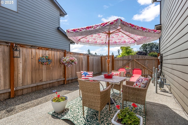 52152 Casswell Dr, Scappoose, OR 97056 - fenced backyard featuring outdoor dining space and a patio area