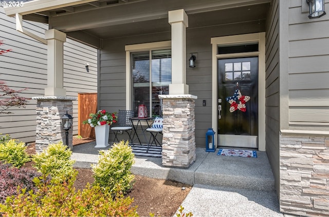 52152 Casswell Dr, Scappoose, OR 97056 - view of exterior entry featuring covered porch and stone siding