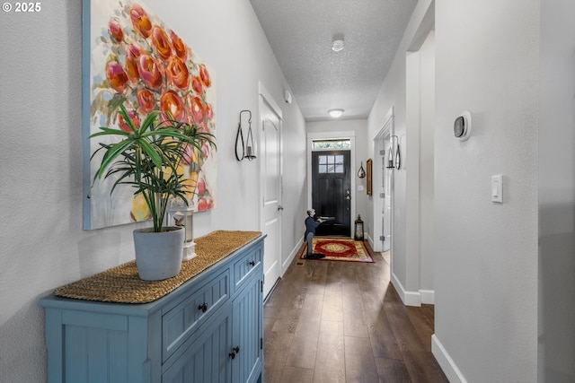 52152 Casswell Dr, Scappoose, OR 97056 - corridor featuring dark wood-style floors and a textured ceiling