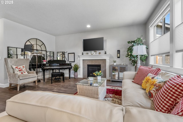 52152 Casswell Dr, Scappoose, OR 97056 - living room featuring wood finished floors, a tiled fireplace, and recessed lighting